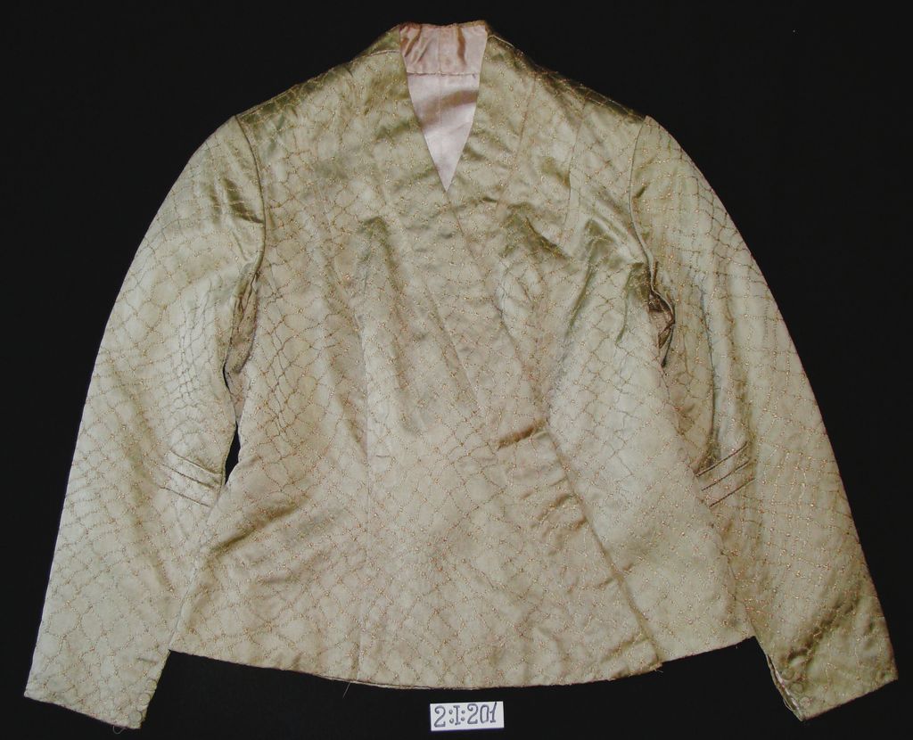 ເສື້ອຄໍປ້າຍ ຜ້າໄໝ ລາຍຕານ່າງ ສີຊາແຫ້ງ.