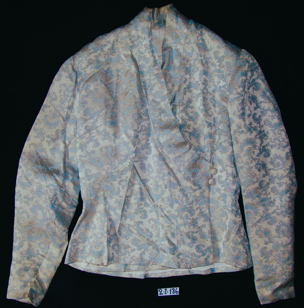 ເສື້ອຄໍປ້າຍ ຜ້າໄໝ ລາຍດອກ ສີທະເລ.