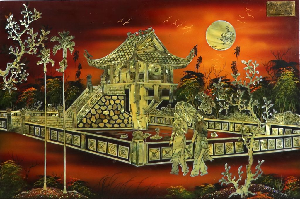 ຮູບ ນູນ ຂອງຂວັນຫວຽດນາມ ເປັນຮູບເຮືອນມີແມ່ຍິງ 2 ຄົນ