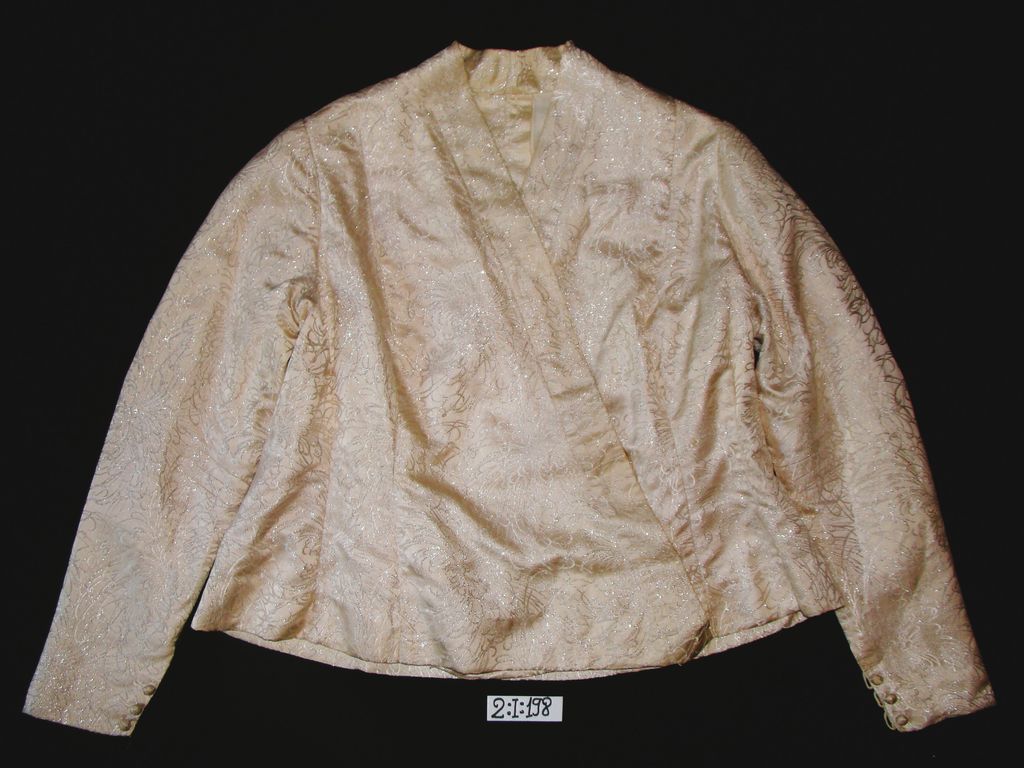 ເສື້ອຄໍປ້າຍ ຜ້າໄໝ ລາຍດອກ ສີຄິມ ດອກໄໝເງິນ.