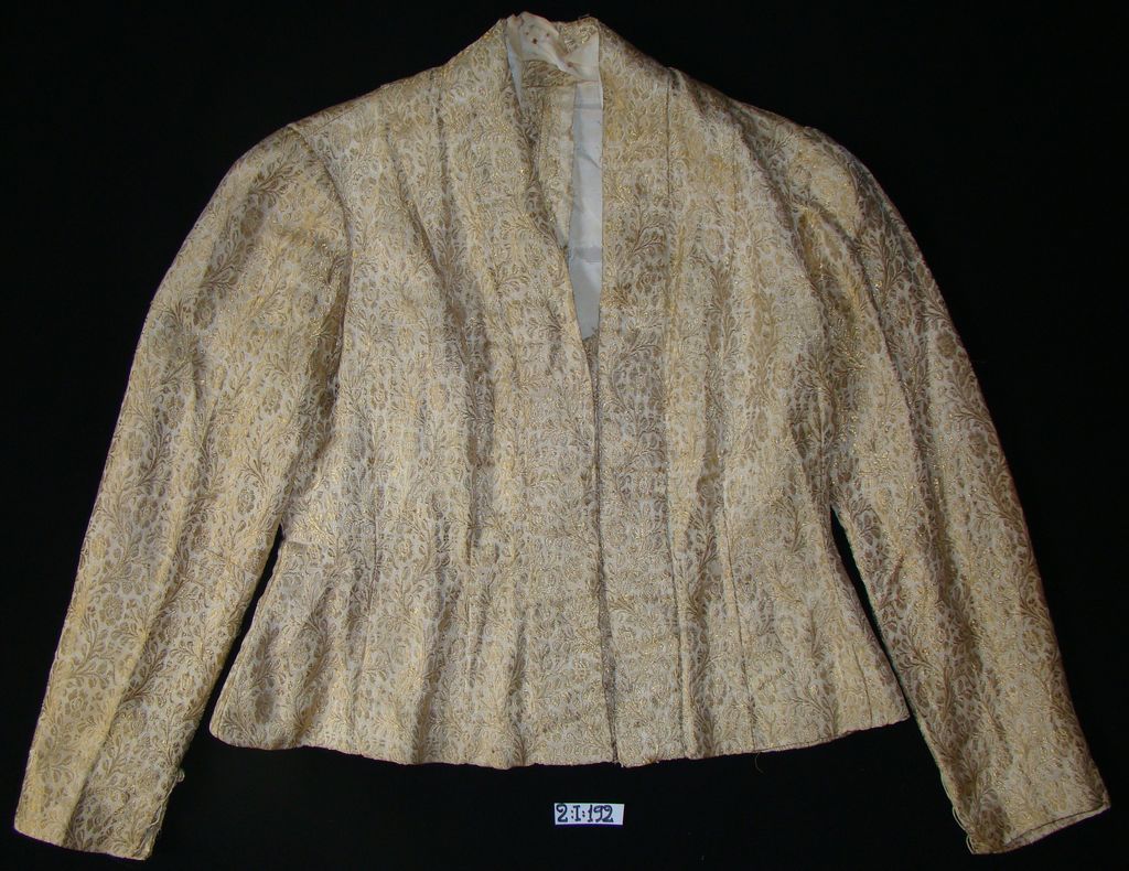 ເສື້ອຄໍປ້າຍ ຜ້າໄໝ ສີຄີີີີີມ ລາຍດອກ ສີດໍາ.